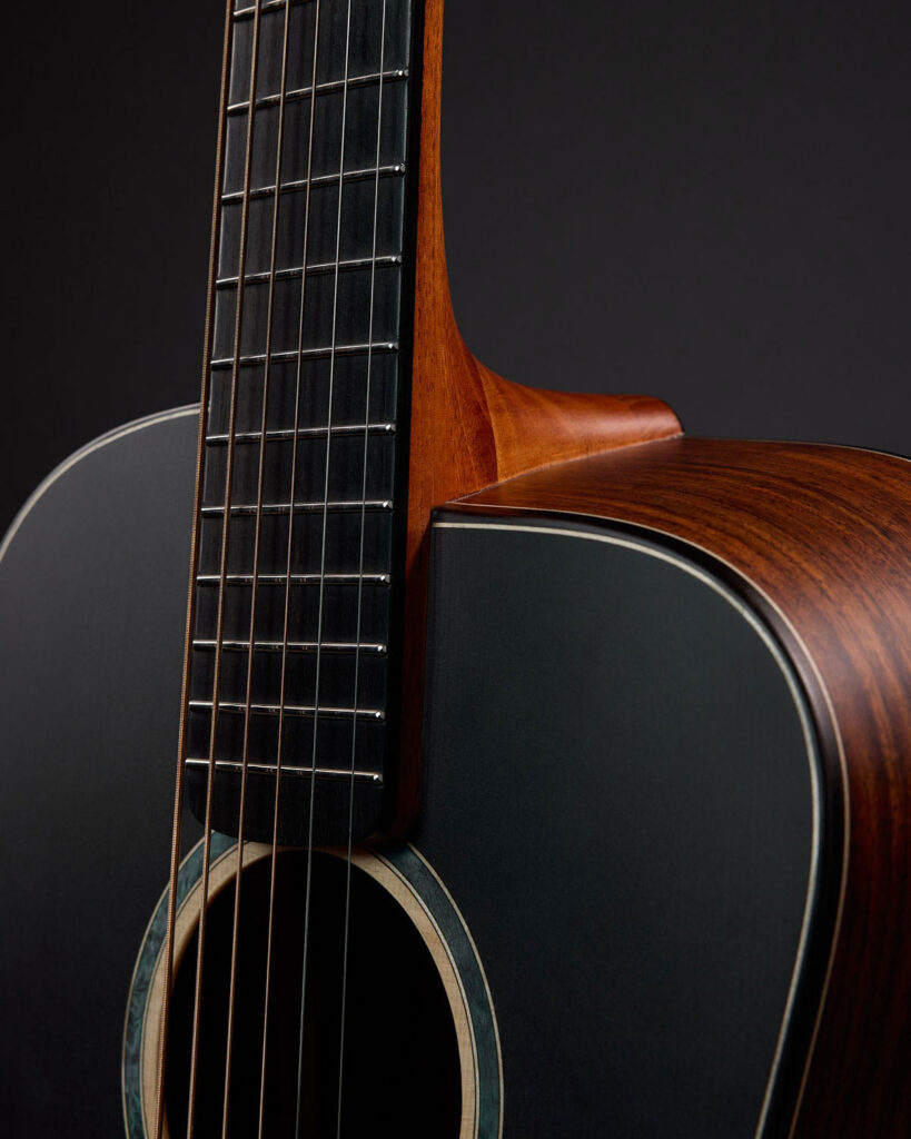 Close-up of Thom Orgler Guitars’ Comfortwave—3D-bent side contour at the neck joint—designed for easier upper-fret access and ergonomic playing.